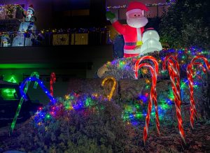 a christmas display with a santa clause and candy canes